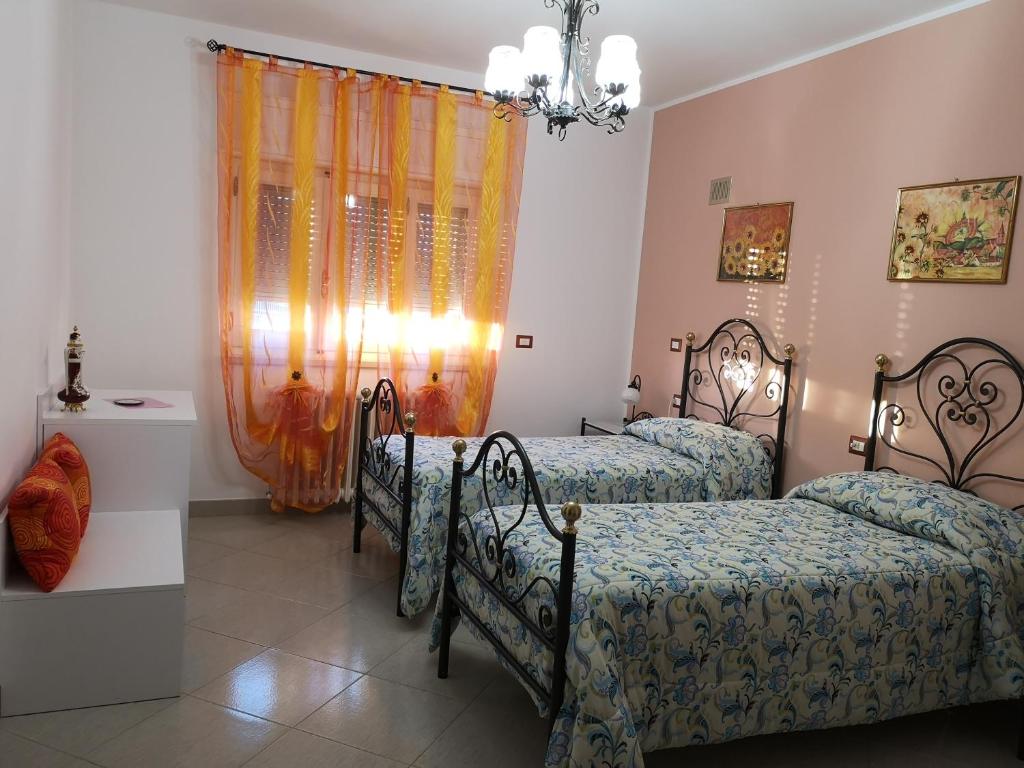 Postel nebo postele na pokoji v ubytování Gianmaria B&B