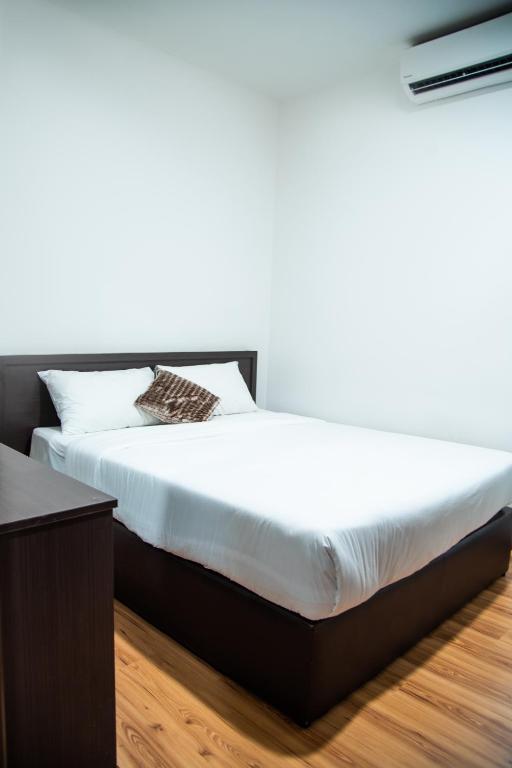 Postel nebo postele na pokoji v ubytování Shuang Ling Inn