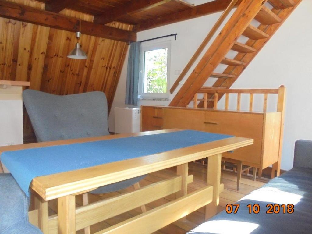 A bed or beds in a room at Wójtówka 16