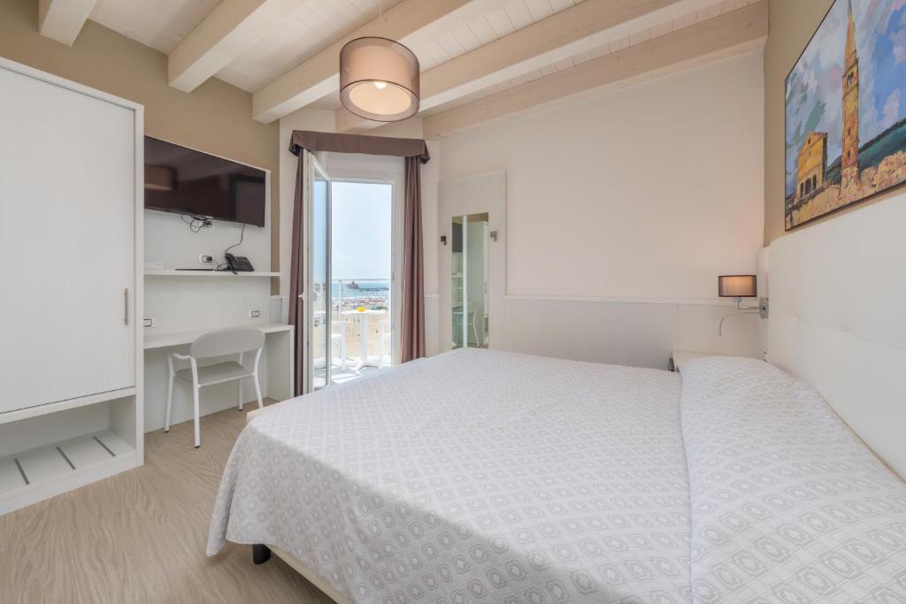 Postel nebo postele na pokoji v ubytování Hotel Garni' Serena