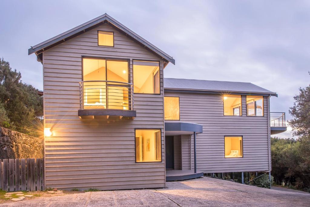 a house with a large window on the side of it at Top of the Hill in Yallingup