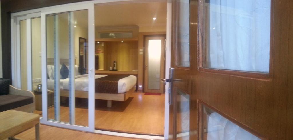 Postel nebo postele na pokoji v ubytování Darshan Resorts Pvt ltd