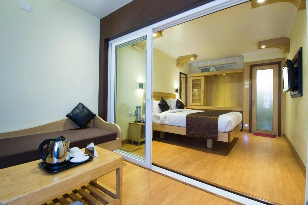 Postel nebo postele na pokoji v ubytování Darshan Resorts Pvt ltd