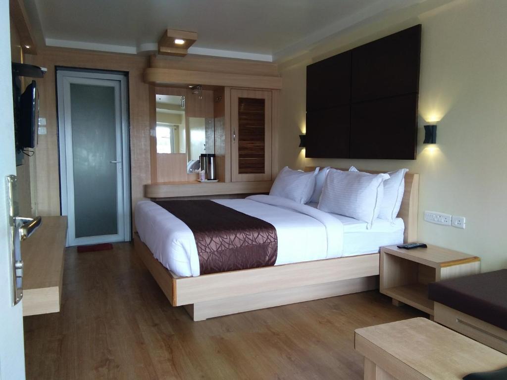 Postel nebo postele na pokoji v ubytování Darshan Resorts Pvt ltd