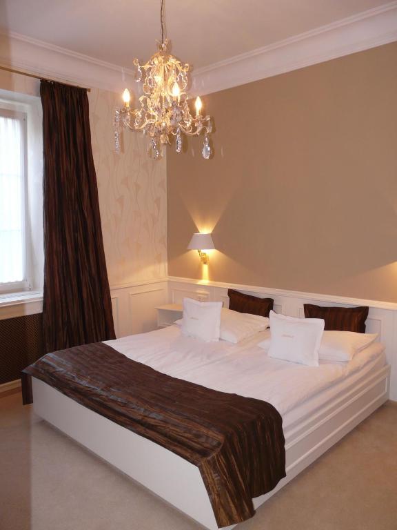 Postel nebo postele na pokoji v ubytování Boutiquehotel Oberkirch im Zentrum