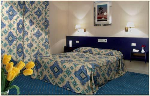 Postel nebo postele na pokoji v ubytování Hotel Concorde Dokki