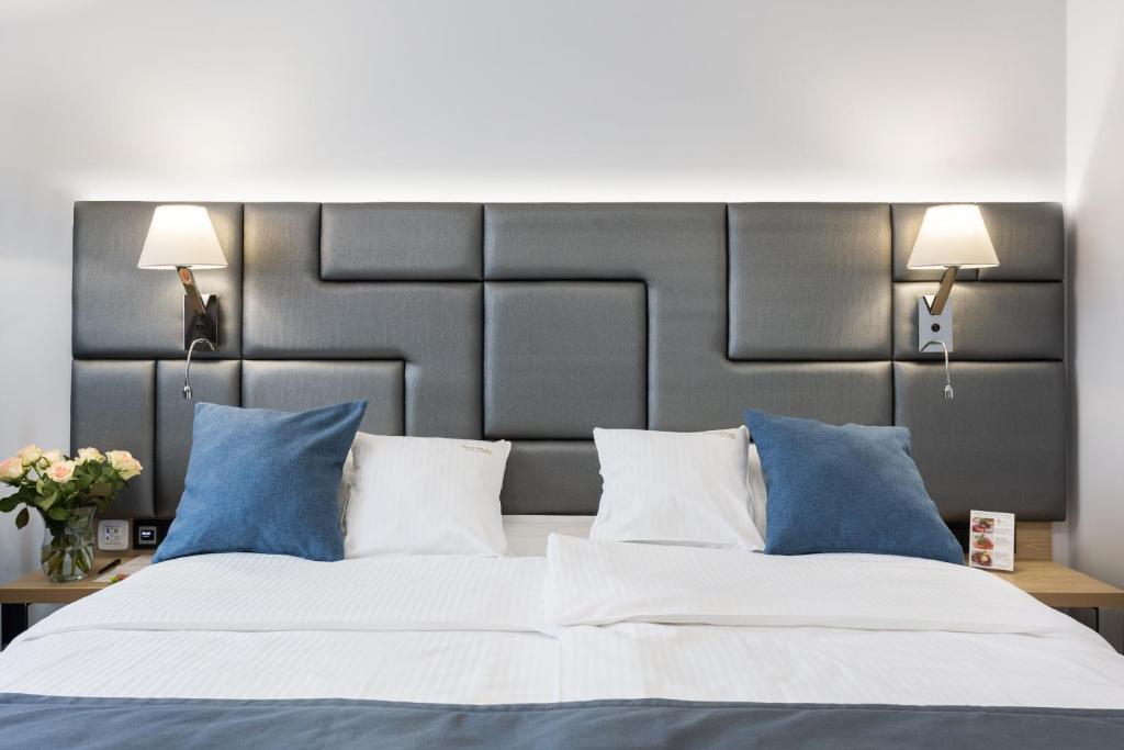 Posteľ alebo postele v izbe v ubytovaní Hotel Włoski Italia Boutique Old Town Poznań