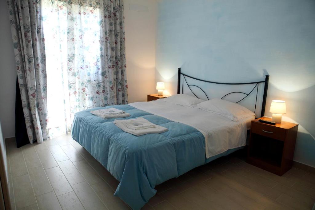 Postel nebo postele na pokoji v ubytování B&B Le Dune Beach