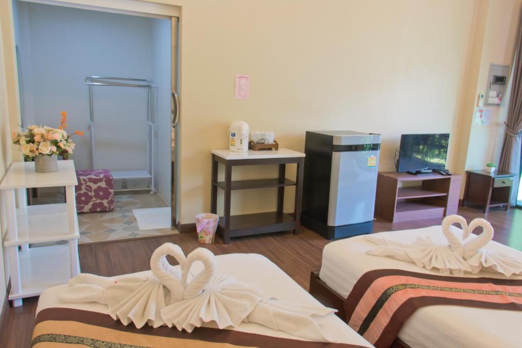 Postel nebo postele na pokoji v ubytování Akantuka Homestay