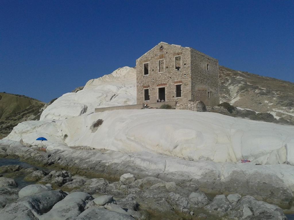 a building on the side of a snow covered mountain at B&B Le Dune Beach in San Leone