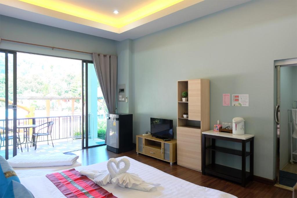 Postel nebo postele na pokoji v ubytování Akantuka Homestay