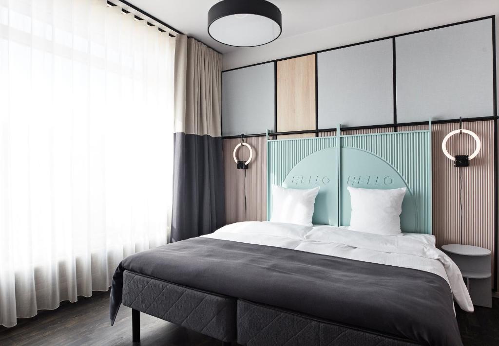 Uma cama ou camas num quarto em CPH Hotel