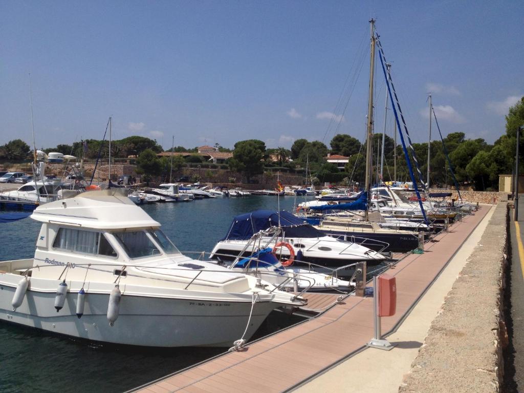 a group of boats docked in a marina at Residencial Marina de Port in L'Ametlla de Mar