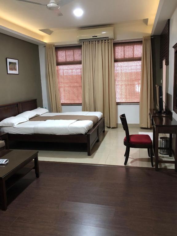 Postel nebo postele na pokoji v ubytování Hotel Ketan