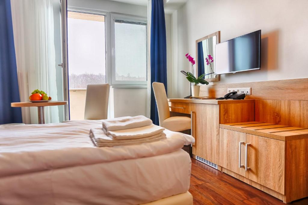 TV a/nebo společenská místnost v ubytování Ensana Spa Smrdáky