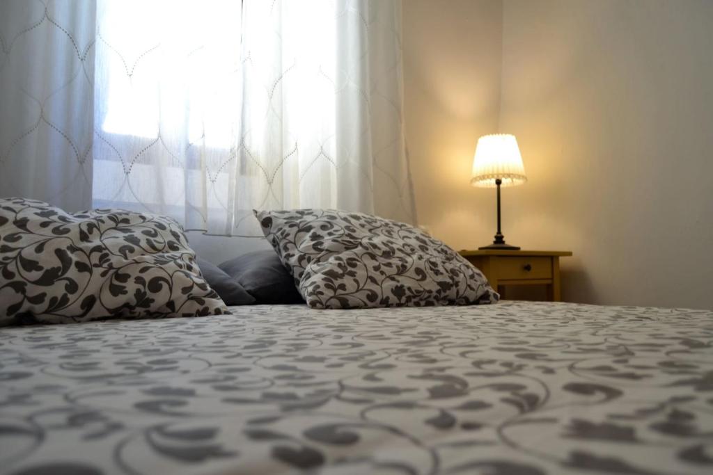 Postel nebo postele na pokoji v ubytování Casa del Arrabal