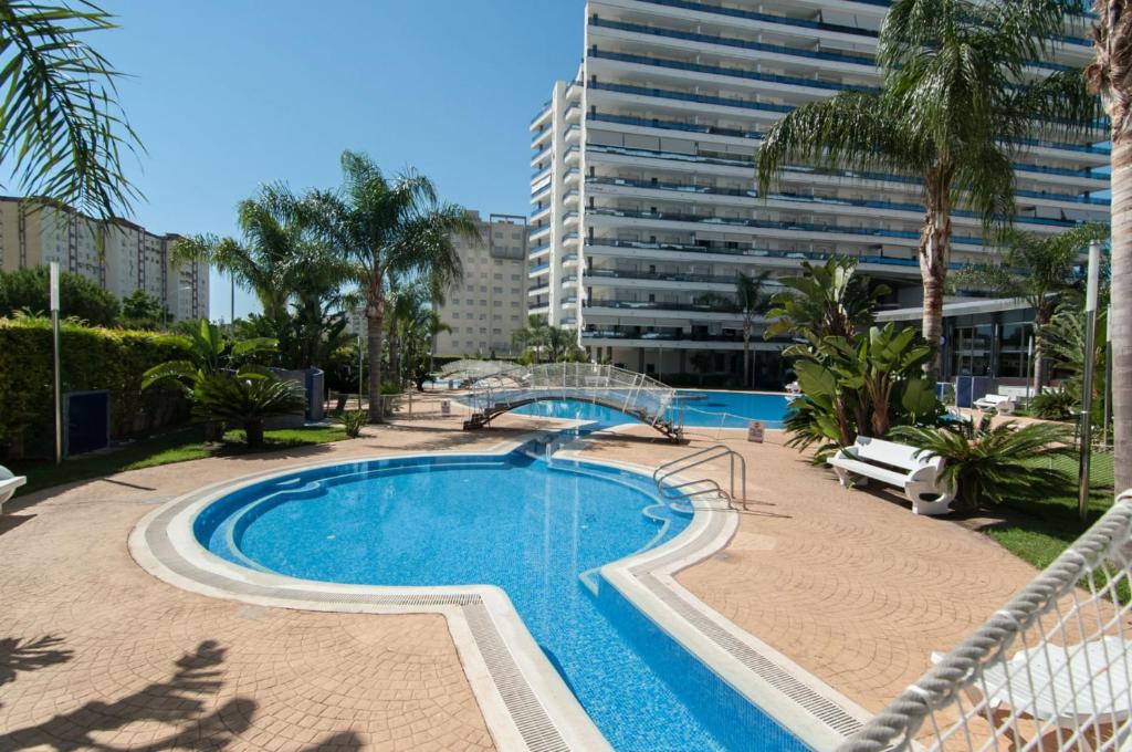 a swimming pool in the middle of a building at Ag Eden Resort in Gandía