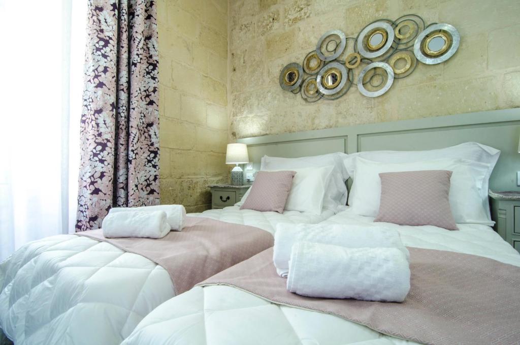 Postel nebo postele na pokoji v ubytování Santa Lucia B & B Suite