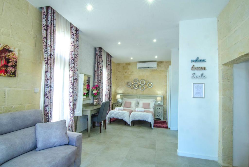 Postel nebo postele na pokoji v ubytování Santa Lucia B & B Suite