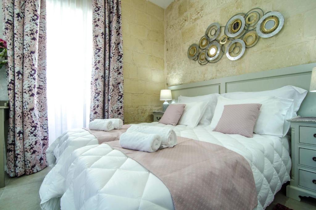 Postel nebo postele na pokoji v ubytování Santa Lucia B & B Suite