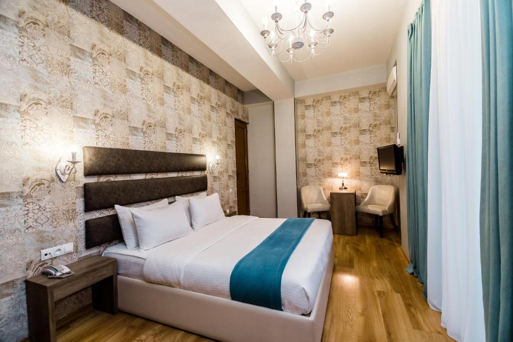 Postel nebo postele na pokoji v ubytování Hotel Diamond