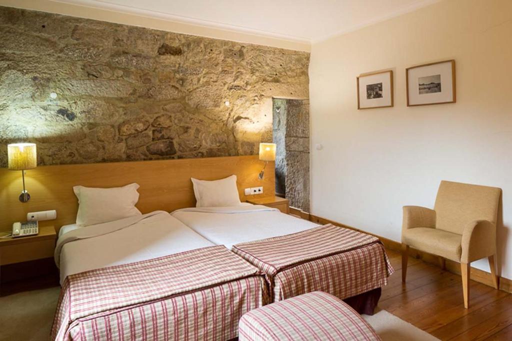 Postel nebo postele na pokoji v ubytování Hotel Rural de Charme Maria da Fonte