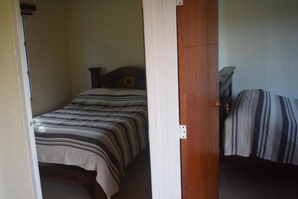 Voodi või voodid majutusasutuse Hostal Fisterra toas