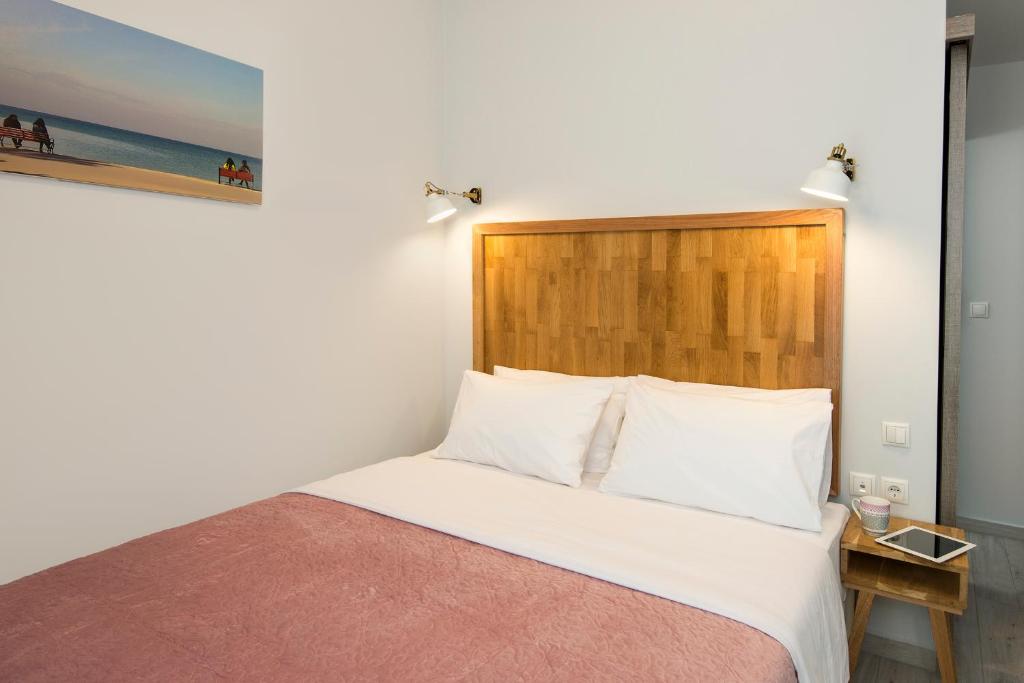 Posteľ alebo postele v izbe v ubytovaní DownTown Hotel