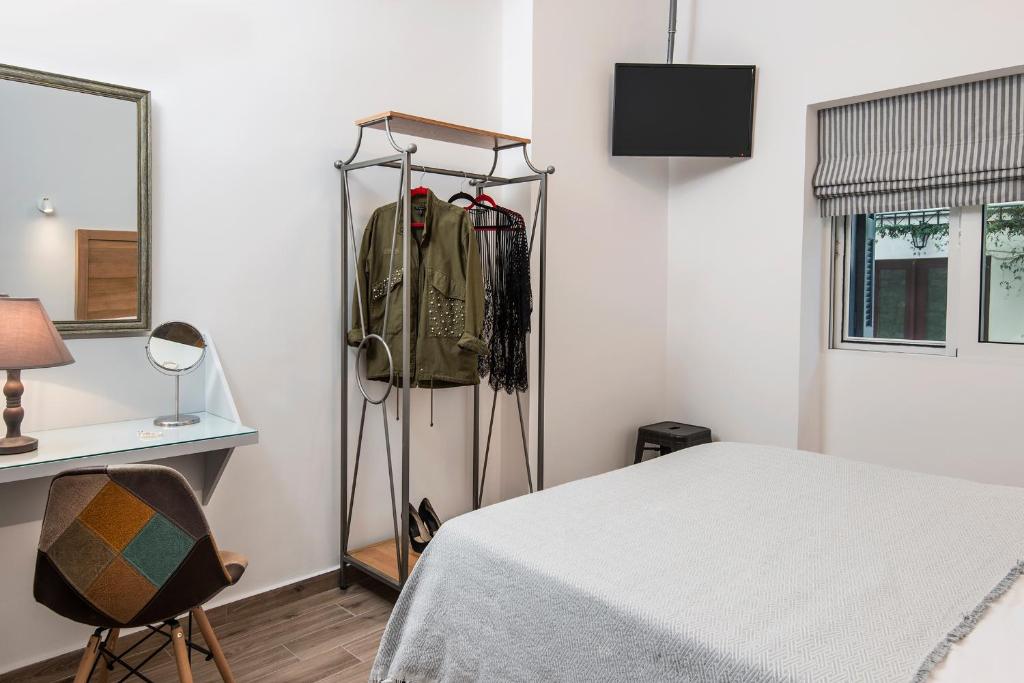 Posteľ alebo postele v izbe v ubytovaní DownTown Hotel