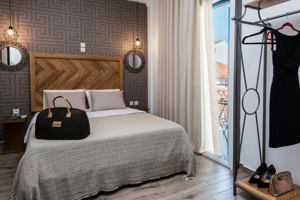 Posteľ alebo postele v izbe v ubytovaní DownTown Hotel