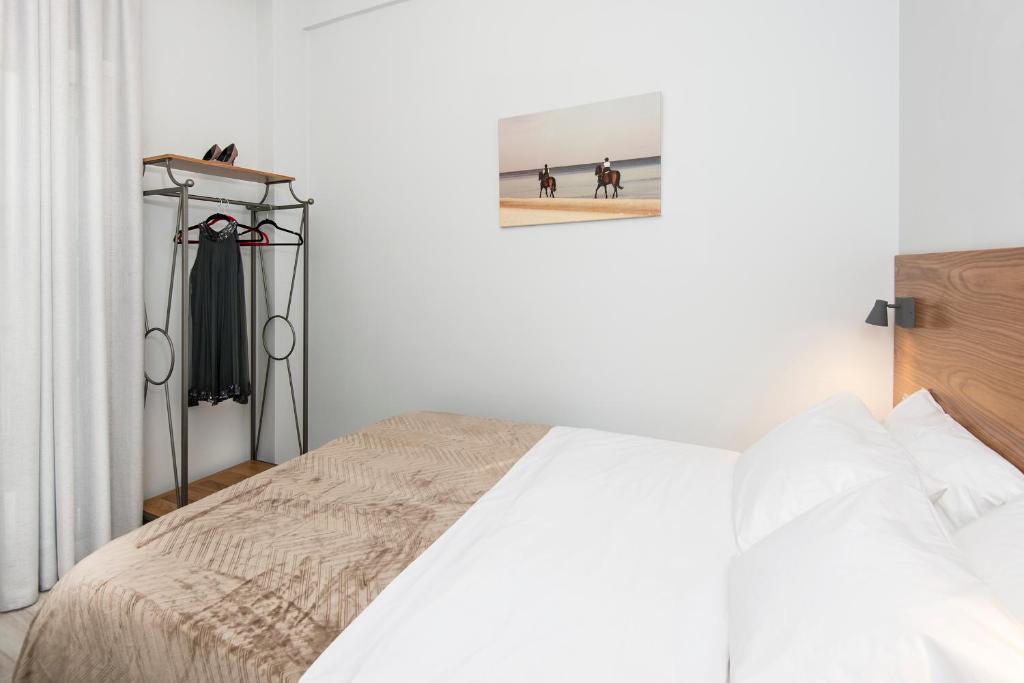 Posteľ alebo postele v izbe v ubytovaní DownTown Hotel