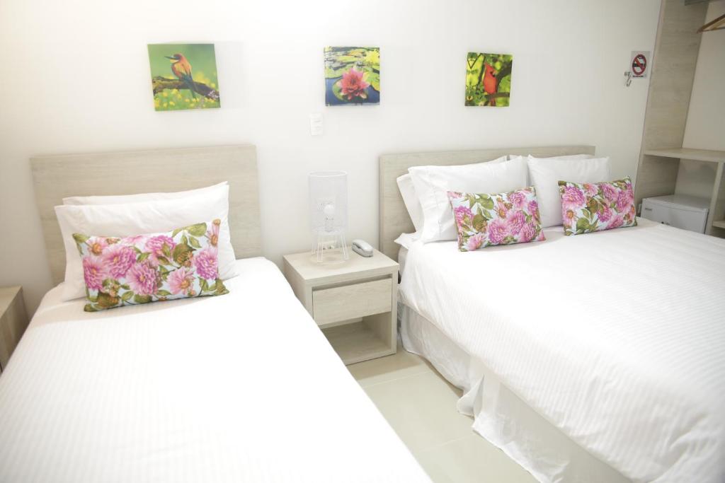 Postel nebo postele na pokoji v ubytování HOTEL HABANA REAL