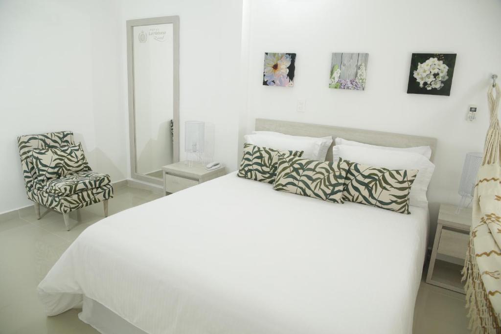 Postel nebo postele na pokoji v ubytování HOTEL HABANA REAL