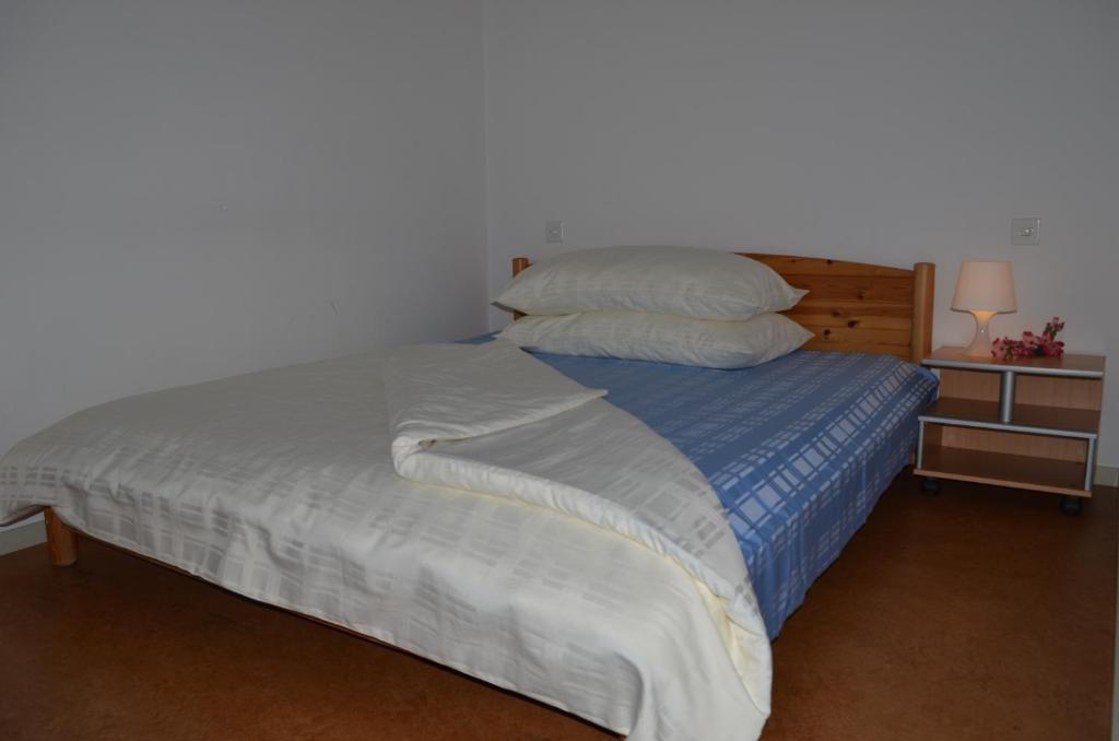 Postel nebo postele na pokoji v ubytování Hotel San Giobbe