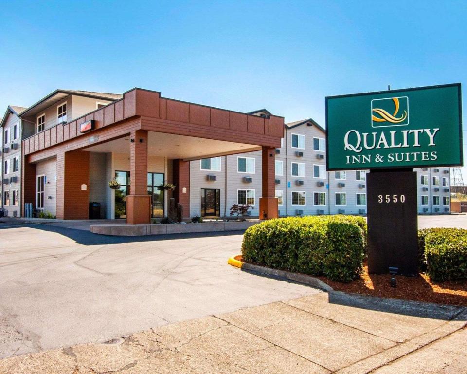 a building with a sign for a quality inn and suites at Quality Inn & Suites Springfield in Springfield