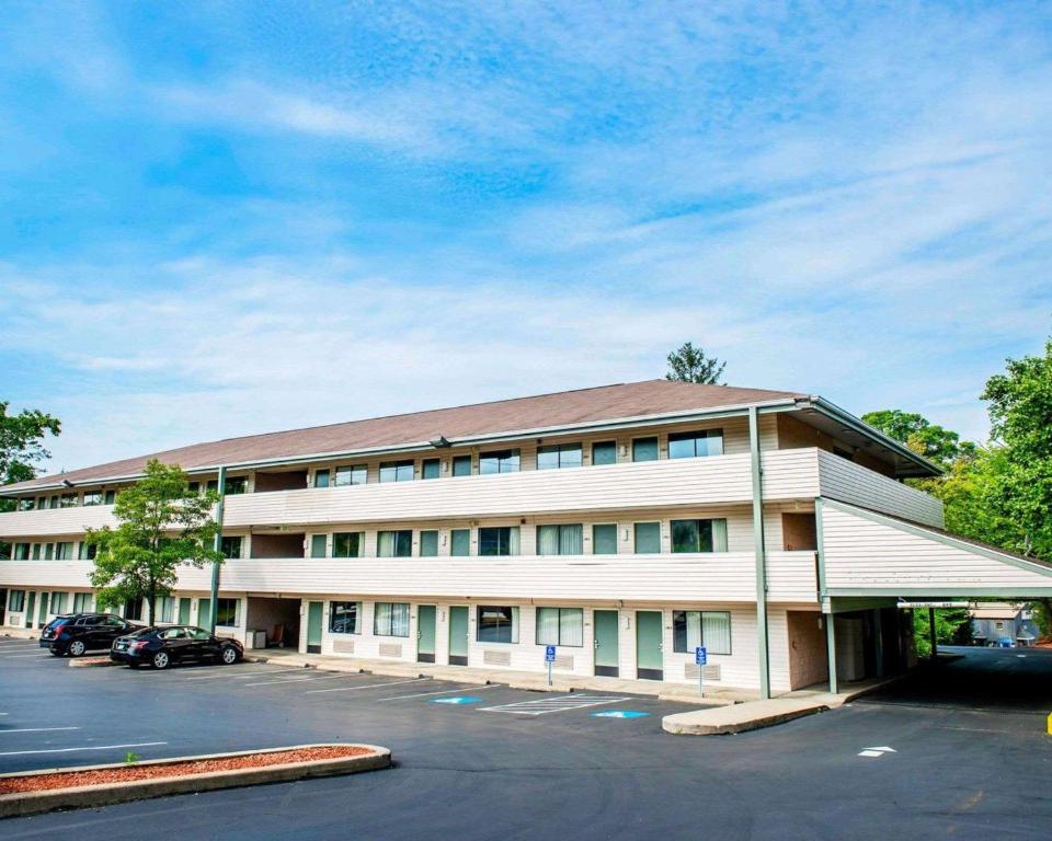 a large white building with a parking lot at Quality Inn & Suites North Gibsonia in Gibsonia