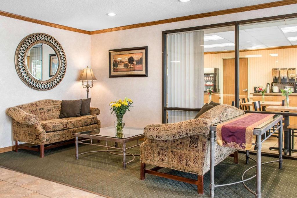 a living room with a couch and a table at Quality Inn Arena in Wilkes-Barre