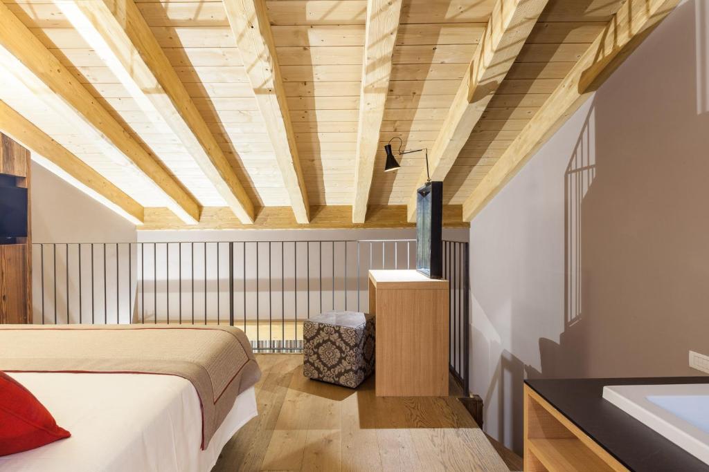 A bed or beds in a room at Excelsior Planet