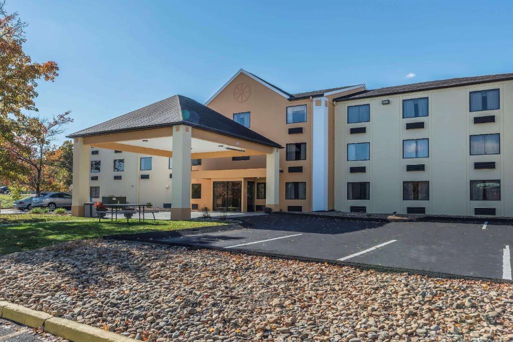 a building with a parking lot in front of it at Quality Inn & Suites in Harmarville