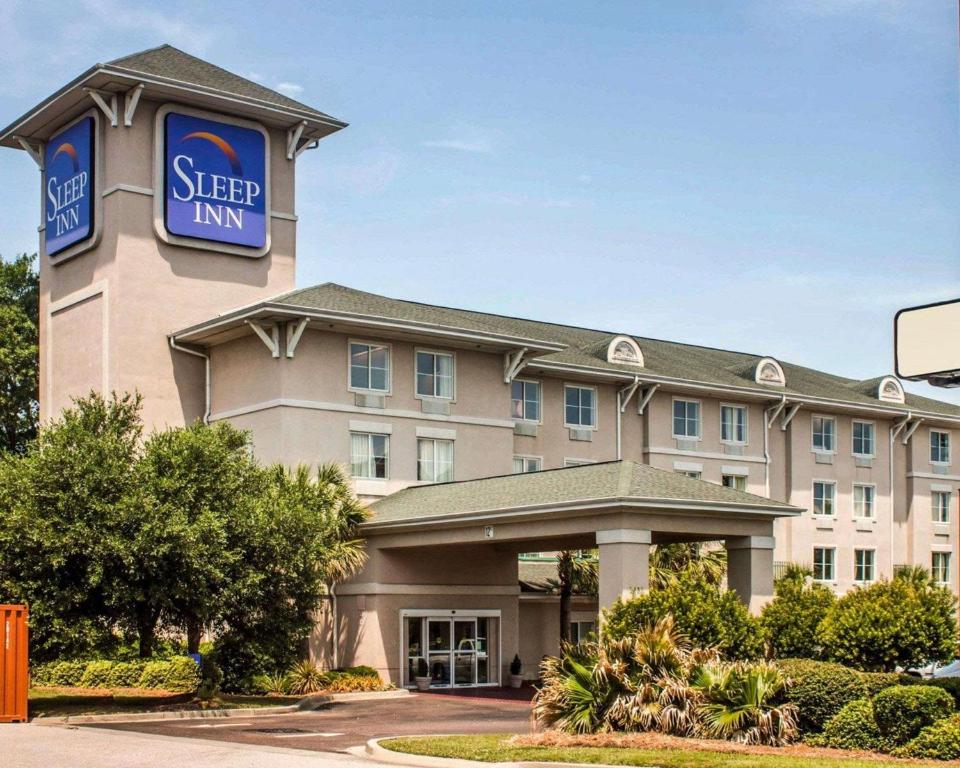 a hotel with a sign that reads sleep inn at Sleep Inn North Charleston Ashley Phosphate in Charleston