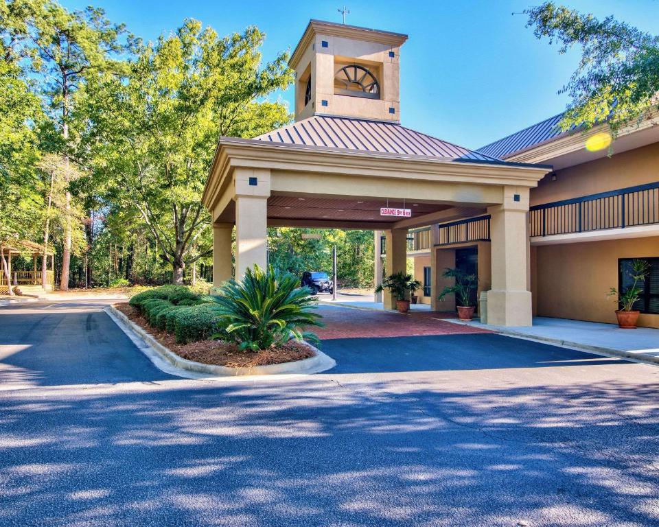 a building with a clock tower on top of it at Clarion Inn & Suites Aiken in Aiken