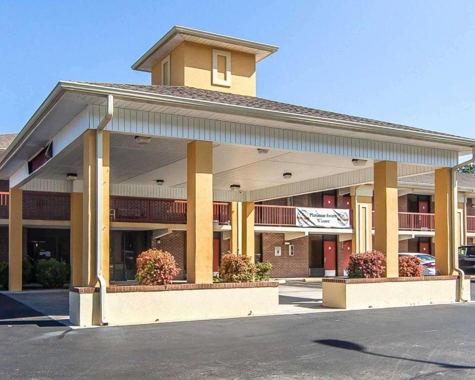 a large building in a parking lot at Quality Inn West in Sweetwater