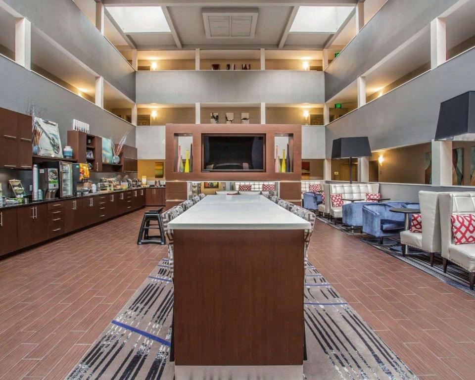 a pool table in the middle of a room at Quality Suites Nashville Airport in Nashville
