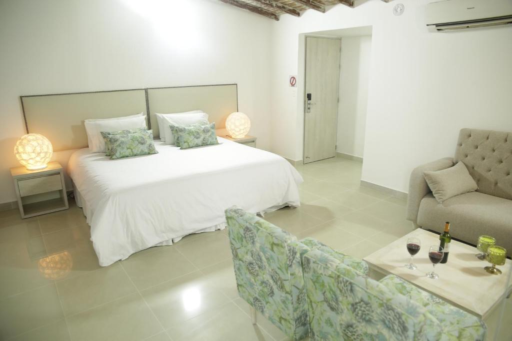 Postel nebo postele na pokoji v ubytování HOTEL HABANA REAL