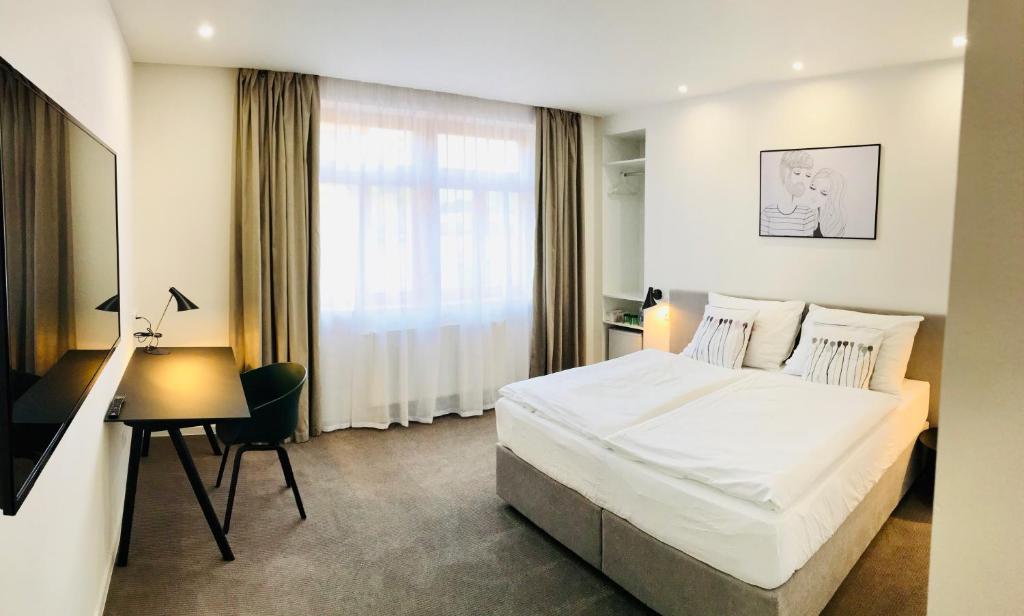 Postel nebo postele na pokoji v ubytování Rozmaryn Hotel B&B