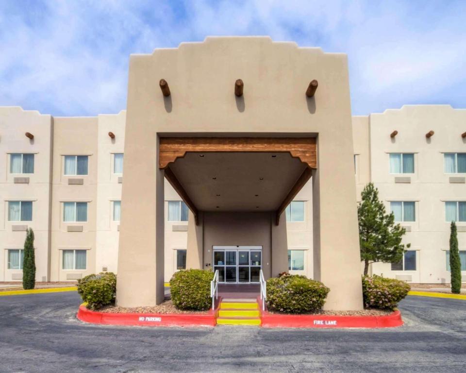 a building at a hospital with a large building at Quality Suites University in El Paso