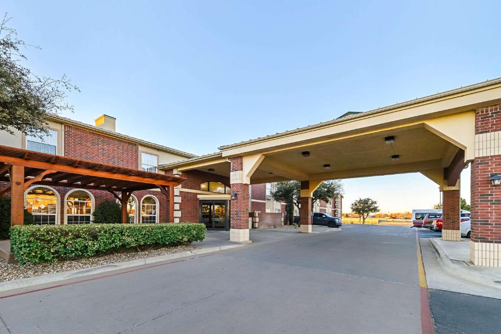 an empty parking lot in front of a building at Quality Inn & Suites in Lubbock