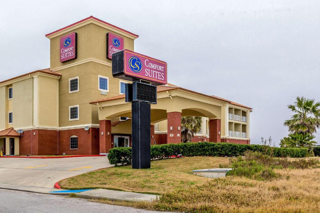 a sign in front of a hotel at Comfort Suites in Galveston
