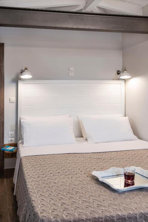 Posteľ alebo postele v izbe v ubytovaní DownTown Hotel