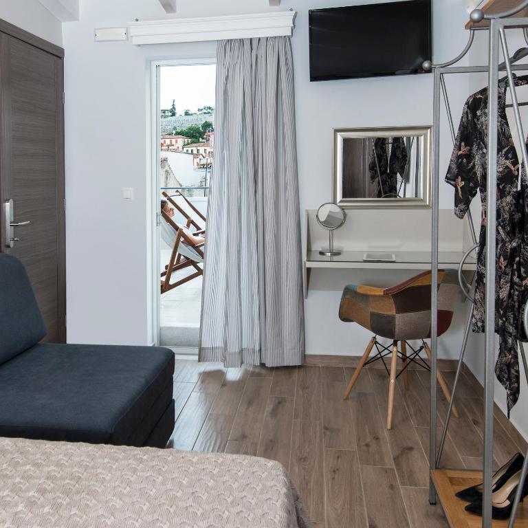 Televízia a/alebo spoločenská miestnosť v ubytovaní DownTown Hotel